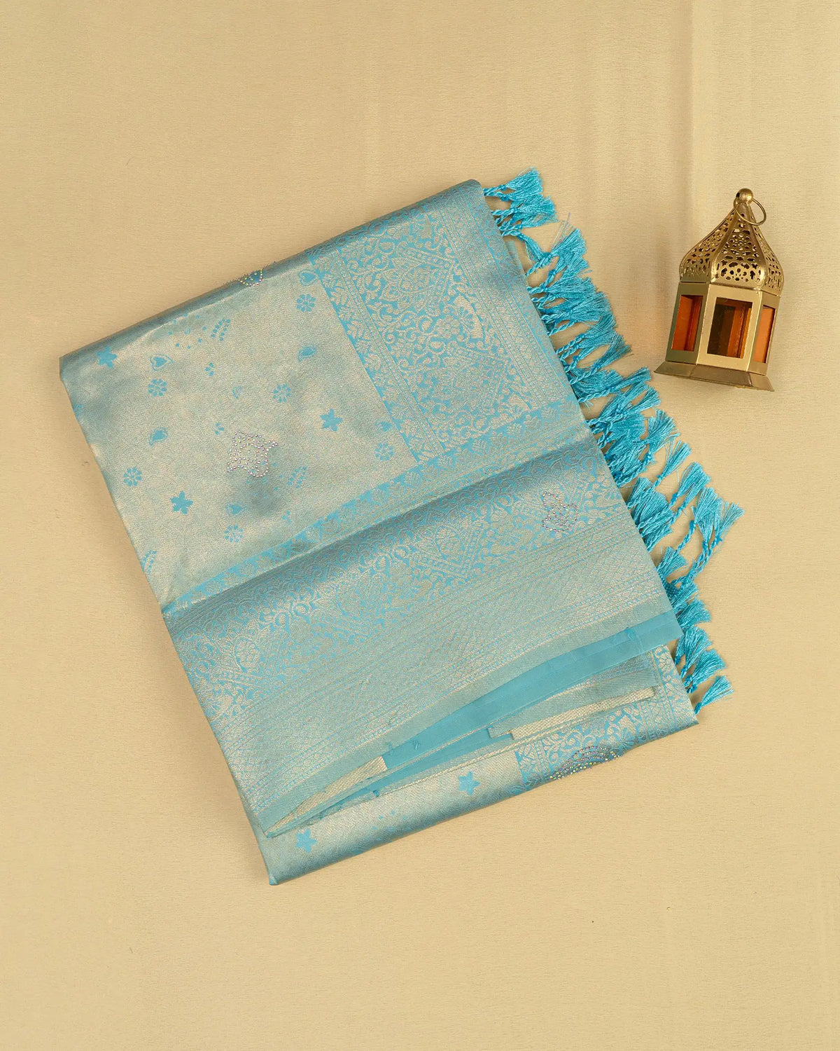 SC3604 - Tissue saree with multistone and embose body design