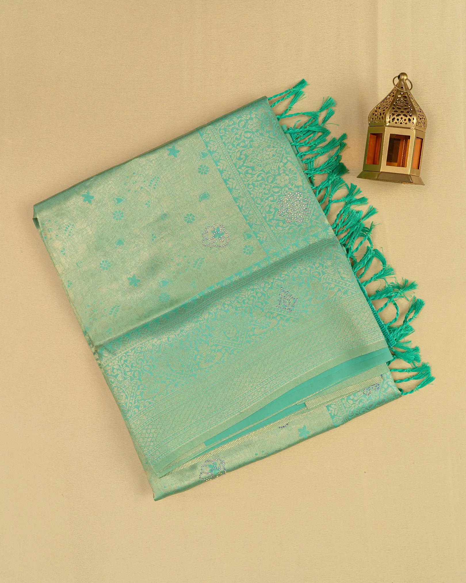 SC3604 - Tissue saree with multistone and embose body design
