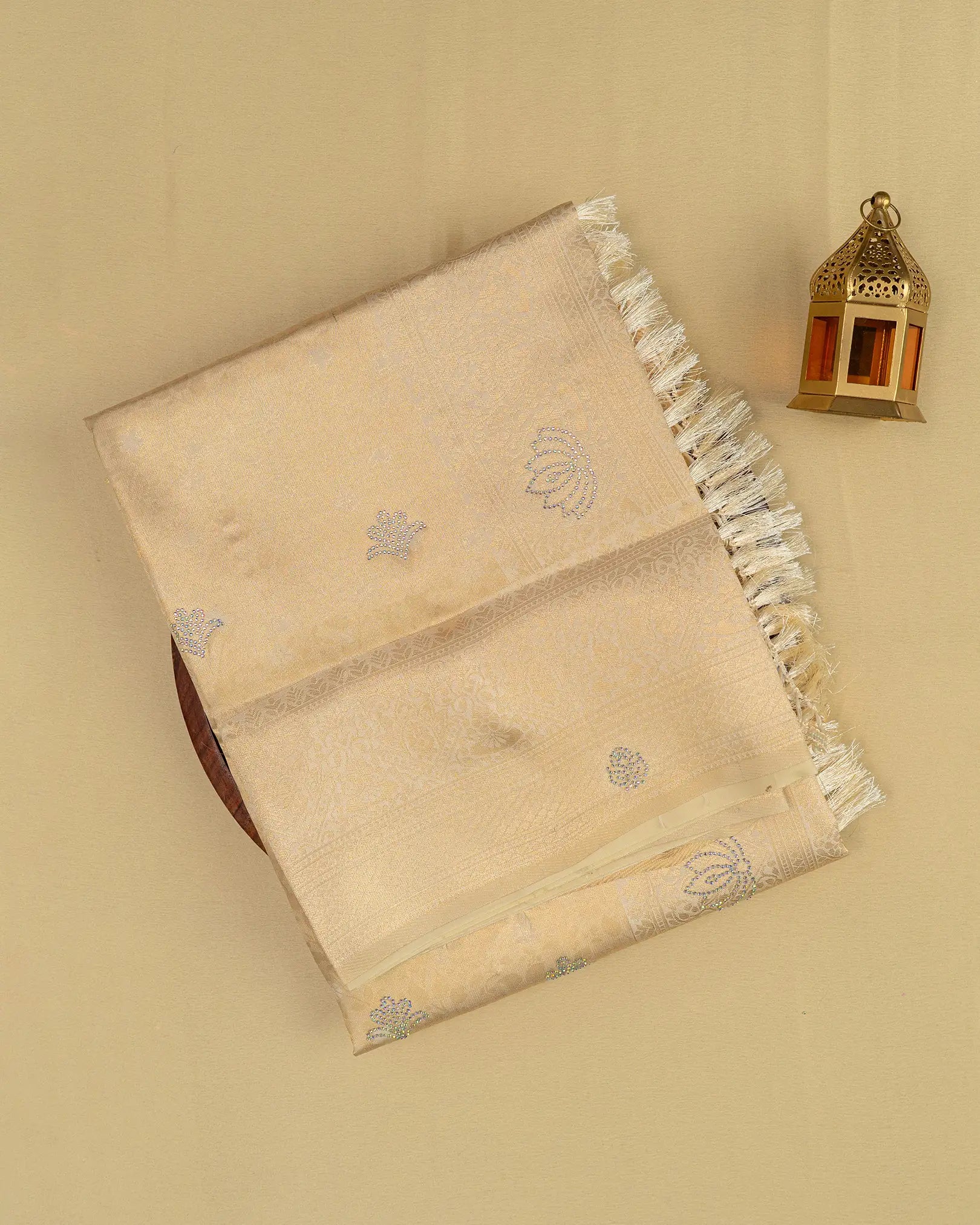 SC3604 - Tissue saree with multistone and embose body design